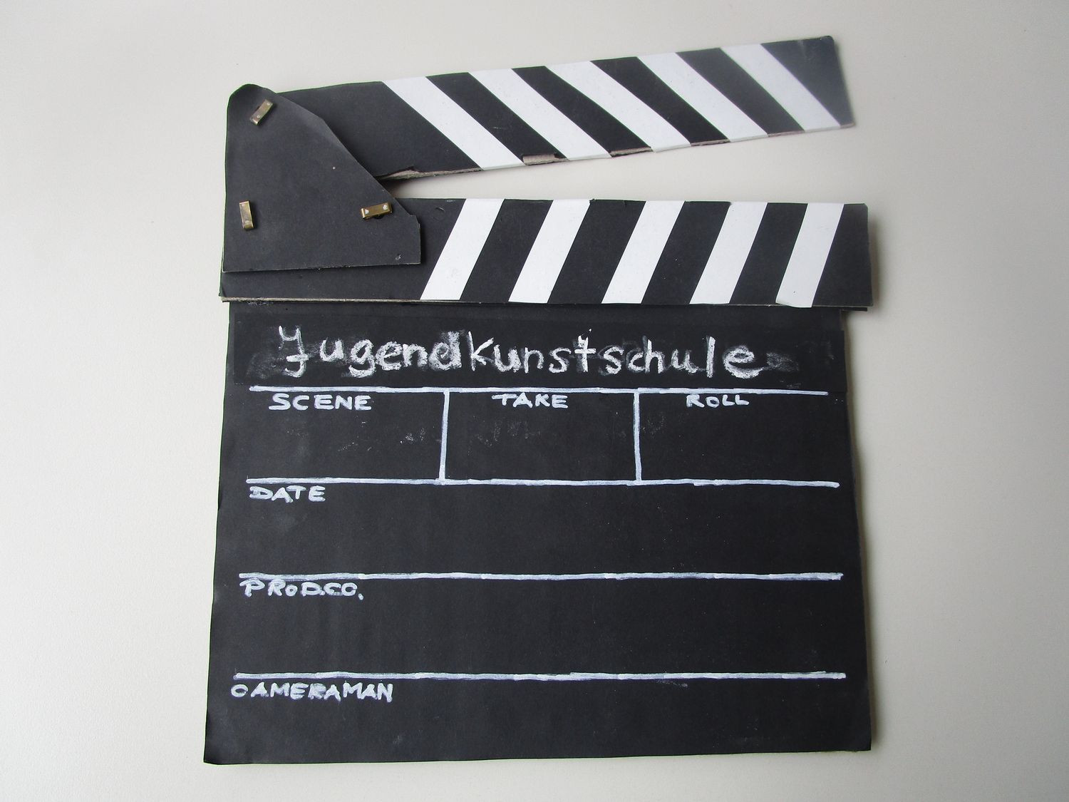 Filmklappe mit der Aufschrift Jugendkunstschule